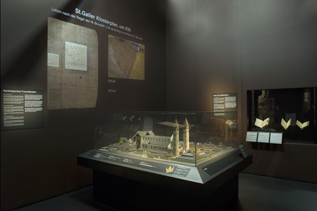 View into the exhibition, in the foreground a nineteenth-century model showing how they imagined at the time the Plan of St Gall being realised in the Middle Ages. Photo: Schweizerisches Nationalmuseum.
