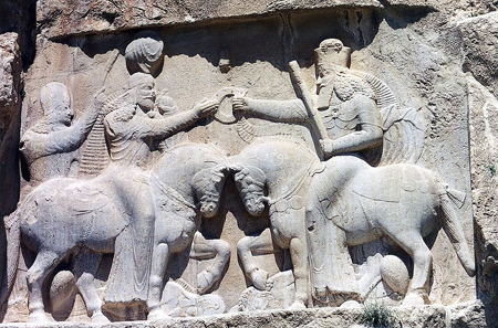 Ardashir I is given the ring of power by Ahura Mazda. Rock relief of Naqsh-e-Rostam. Photograph: Ginolerhino / http://creativecommons.org/licenses/by-sa/3.0/deed.en