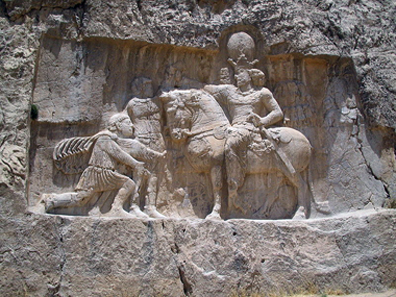 A rock relief at Naqsh-e Rostam (Iran) depicts the triumph of Shapur I over the Roman emperor Valerian. Photograph: Fabienkhan / http://creativecommons.org/licenses/by-sa/2.5/deed.en