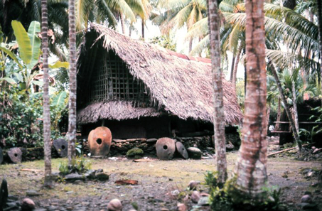Rai stones in front of a native home. Photo: Dr. James P. McVey, NOAA Sea Grant Program. http://www.photolib.noaa.gov/htmls/mvey0120.htm