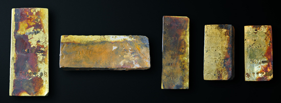 Five gold bars, totaling approximately 1,000 ounces, were recovered by Odyssey Marine Exploration during the first reconnaissance dive to the 2,200 meter deep SS Central America shipwreck site in April 2014. The bars were stamped with various assayer's marks and weights that range from 96.5 to 313.5 troy ounces. Copyright: Odyssey Marine Exploration, Inc., www.OdysseyMarine.com.