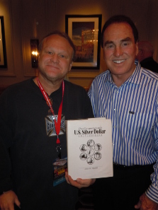 John Highfill presenting the Silver Dollar Encyclopedia to Rodney Winks at the seminar.