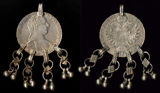 Pendant from Yemen made from a silver Maria Theresa thaler, 1950s. These coins were originally minted in the Hapsburg Empire but from the late 18th century onwards were used across the Indian Ocean. © The Trustees of the British Museum.