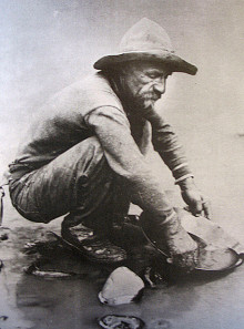 A forty-niner peers into the slit of California's American River. Photo: Wikipedia.