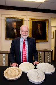 Graham Dyer with all four coinage portraits of The Queen.