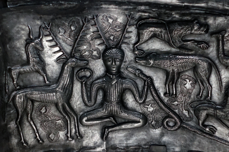 Gundestrup Cauldron / detail: Antlered god holding a torque in his hand. Photo: UK.
