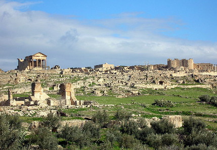 Visitors from throughout the world come to Tunisia, to see the ruins of Dougga with their own eyes. Photograph: Bernard Gagnon / https://creativecommons.org/licenses/by-sa/3.0/deed.en