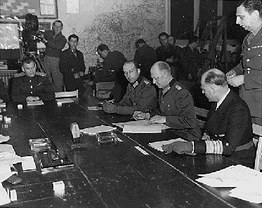 Colonel General Jodl signs the instruments of unconditional surrender in Reims on 7 May 1945.