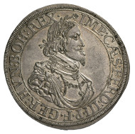 Free Imperial City Augsburg. Taler, 1641. Armoured and draped bust of Emperor Ferdinand III of Habsburg (1637-1657) to the right, around his neck the chain of the Order of the Golden Fleece. Rv. Cityscape of Augsburg, in the foreground city fortifications, in the very foreground the city's coat of arms with pine cone framed by cartouche. © MoneyMuseum, Zurich.