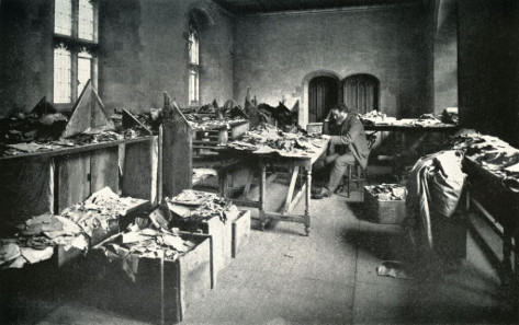 Solomon Schechter at his desk in Cambridge about 1898, working with documents from the Cairo Genizah from the Ben Ezra synagogue. Photograph, late 19th century. © Reproduced by the kind permission of the Syndics of Cambridge University Library.