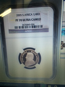 The counterfeit quarter-ounce Krugerrand in a counterfeit NGC holder that was purchased in Fullerton, California. Photo courtesy of Dwight Manley.