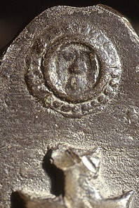 Fragment of a bell in honor of Pope Felix V, featuring the papal coat of arms and the impressions of a Basel rappen and a stäbler, with the Baselstab (crozier) shield in a linear border and a dotted border, in accordance with the 1425 Treaty, HMB inv. 1873.55.