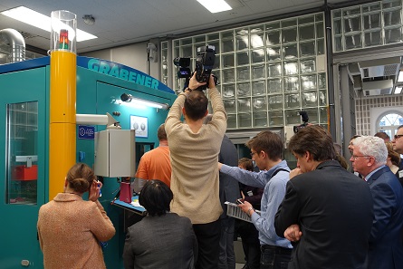 Followed with great interest by the media, the new polymer coin is struck for the very first time. Photograph: UK.
