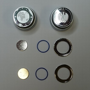 The different parts of the coin and a coining die. Photograph: UK.