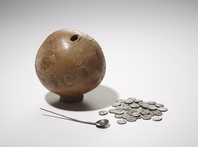 A Roman ceramic money box, silver coins and spoon found by a boy digging in his back garden in Muswell Hill in 1928. © The Trustees of the British Museum.