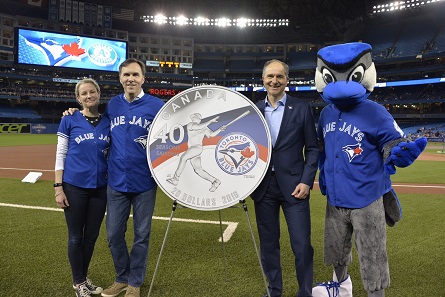 From left: Royal Canadian Mint CEO Sandra Hanington, Minister of Finance Bill Morneau and Robert Witchel, Executive Director of Jays Care Foundation unveil a new silver collector coin at Rogers Centre to celebrate the 40th season of the Toronto Blue Jays.