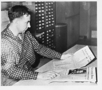 Chet compares the first issue of his Numismatic News with the one dating from January 5, 1959. Photograph: Krause Publications.