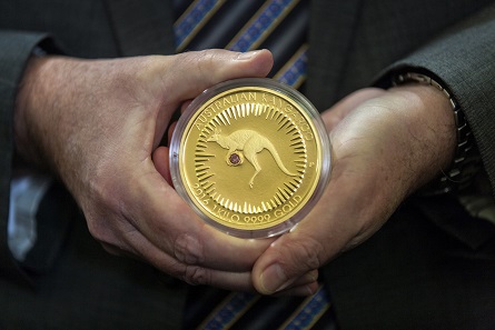 Perth Mint Chief Executive Officer, Richard Hayes holding the Kimberley Treasure coin.