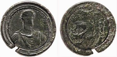 Bronze medallion of Commodus struck from two alloys and set in a wider rim, showing his facing bust, whose face has been erased; Rome, AD 191. © The Trustees of the British Museum.