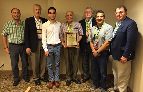 Dr. Levon Saryan holding the lifetime achievement award for Y.T. Nercessian; also pictured is ANRO founder Aram Manasaryan, ANAS founder Chuck Hajinian, author Frank L. Kovacs and attendees Dan Pelc, Bob Leonard and Armen Moloian. Photo: © ANAS.