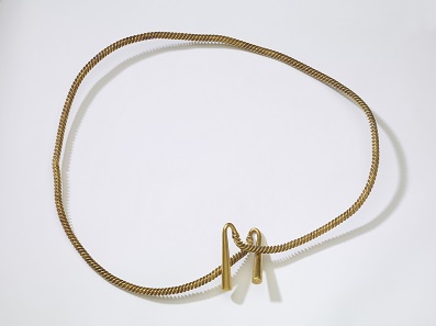 Bronze Age gold torc or armlet from Cambridgeshire (CAM-E5D871), which dates to circa 1300-1100 BC. This example survives as a single hoop, rather than being coiled. It has a three-flange twisted body and plain recurving terminals which expand gently towards the ends. Speaker: Expert, BM curator of European Bronze Age. © The Trustees of the British Museum.