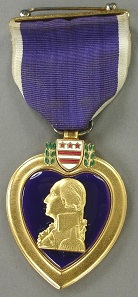 Purple Heart, awarded to Seaman 1st Class Joseph H. Mills who was killed in action on April 12, 1945, when his ship, the destroyer USS Mannert L. Abele, was sunk in a Japanese kamikaze attack during the battle for Okinawa.