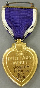 Purple Heart, awarded to Seaman 1st Class Joseph H. Mills who was killed in action on April 12, 1945, when his ship, the destroyer USS Mannert L. Abele, was sunk in a Japanese kamikaze attack during the battle for Okinawa.