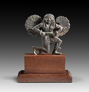 Lot 21a: Gorgo Medusa. Greece, around 500 BC. H 7 cm. Solid bronze cast. From P.M.W. Collection, England. Estimate: 12,000,- euros. Hammer price: 22,000,- euros.