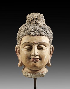 Lot 728: Head of Buddha. Gandhara, 2nd-3rd cent. AD. H 23.5 cm. Terracotta covered with colored plaster. From Kotalla Collection. Estimate: 2,500,- euros. Hammer price: 10,000,- euros.