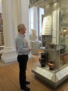 Adi Popescu shows us coins which are incorporated into the show rooms of the Fitzwilliam Museum. Image: UK.