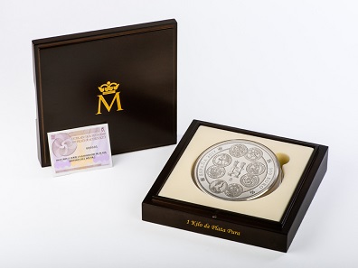 The coin comes in a wooden case with a booklet on the history of the dollar.