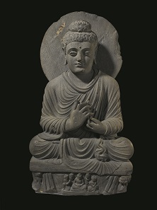 Statue of a seated Buddha preaching, 2nd century – 3rd century, Ghandara, Pakistan. Photo: © Trustees of the British Museum.