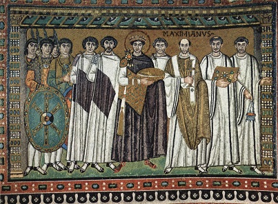 Byzantine Emperor Justinian next to his court officials. Mosaic from San Vitale / Ravenna. Source: Wikipedia.