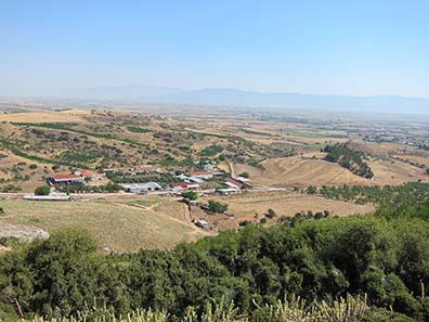 The constructed acropolis of Pherai, a farmyard to the left. Photograph: KW.