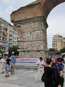 Gathering to demonstrate in front of the Arch of Galerius. Photograph: KW.