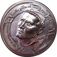 The first medal in the series commemorating the 500th anniversary of the Protestant Reformation shows Martin Luther as a young monk.