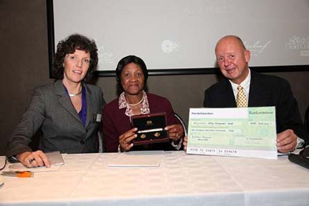 (left to right): Embracing the partnership, Norwegian Ambassador to South Africa, Kari Bjørnsgaard, Mrs Albertina Luthuli, daughter of Chief Albert Luthuli and Jan Eirik Hansen, the new Mint Director of the Mint of Norway at the launch of the Mandela Luthuli Laureate twin set.