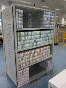 A storage rack with parcels of money. Senseless to reflect on how many millions are gathered here. Photo: UK.