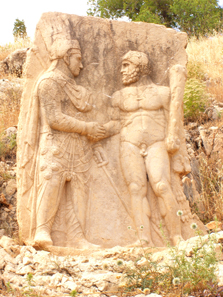 A king of Commagene (Mithridates or Antiochus) clasping hands with Heracles. Photograph: UK.