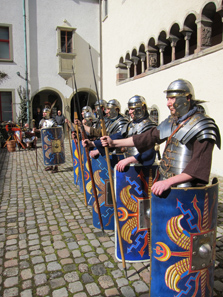 Roman soldiers in the mediaeval abbey courtyard. Photo: UK.