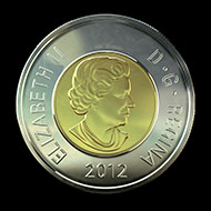 The new two-dollar coin struck with the patented multi-ply plated steel technology.