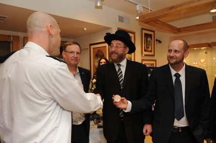 Right Aviv Katz CEO of Israel Coins and Medals, Rabbi Yoram Cohen, Joseph Horowitz, director of business development and marketing Rafael and Lieutenant Colonel Yossi representative of the security forces.