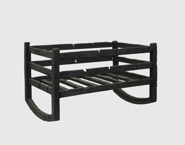 Carbonised wooden cradle. From the House of M.P.P.Granianus, Herculaneum, 1st century AD. Copyright Soprintendenza Speciale per i Beni Archeologici di Napoli e Pompei / Trustees of the British Museum.
