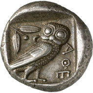 Athens. Tetradrachm, around 450 BC. Head of the goddess Athena with helmet, facing right, on the helmet are a palmette and three ornamental leaves of the olive tree. Reverse, sitting owl, facing right, a branch of the olive tree behind it with leaves and fruit, as well as a crescent moon. © MoneyMuseum, Zurich.