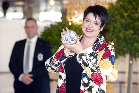 Marianne Rapp Ohmann showing one of the 5 ounce pieces with the popular Panda motif that was part of a comprehensive China collection.