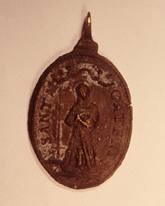 Spanish sailors of the seventeenth century were devoutly religious and the ship's passenger lists often included Catholic clergy. A small brass medallion with religious figures on both sides is an especially prized piece recovered from the