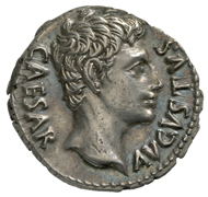 Roman Imperial Era. Augustus (27 BC-14 AD). Denarius, Cologne, 19 BC. Head of Augustus in idealized form facing right. Rev. Clupeus Virtutis (see text), to the left, eagle, and to the right, battle standards. © MoneyMuseum, Zurich.