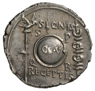 Roman Imperial Era. Augustus (27 BC-14 AD). Denarius, Cologne, 19 BC. Head of Augustus in idealized form facing right. Rev. Clupeus Virtutis (see text), to the left, eagle, and to the right, battle standards. © MoneyMuseum, Zurich.