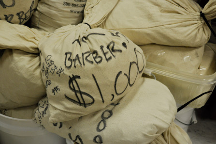 Some bags are filled with Barber Quarters or other denominations.