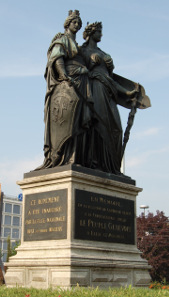 Helvetia is taking Geneva under her wings. Memorial to the accession of Geneva to the Swiss Confederation in 1814, inaugurated in 1869. Photo: Norbert Aepli - CC-BY-2.5.